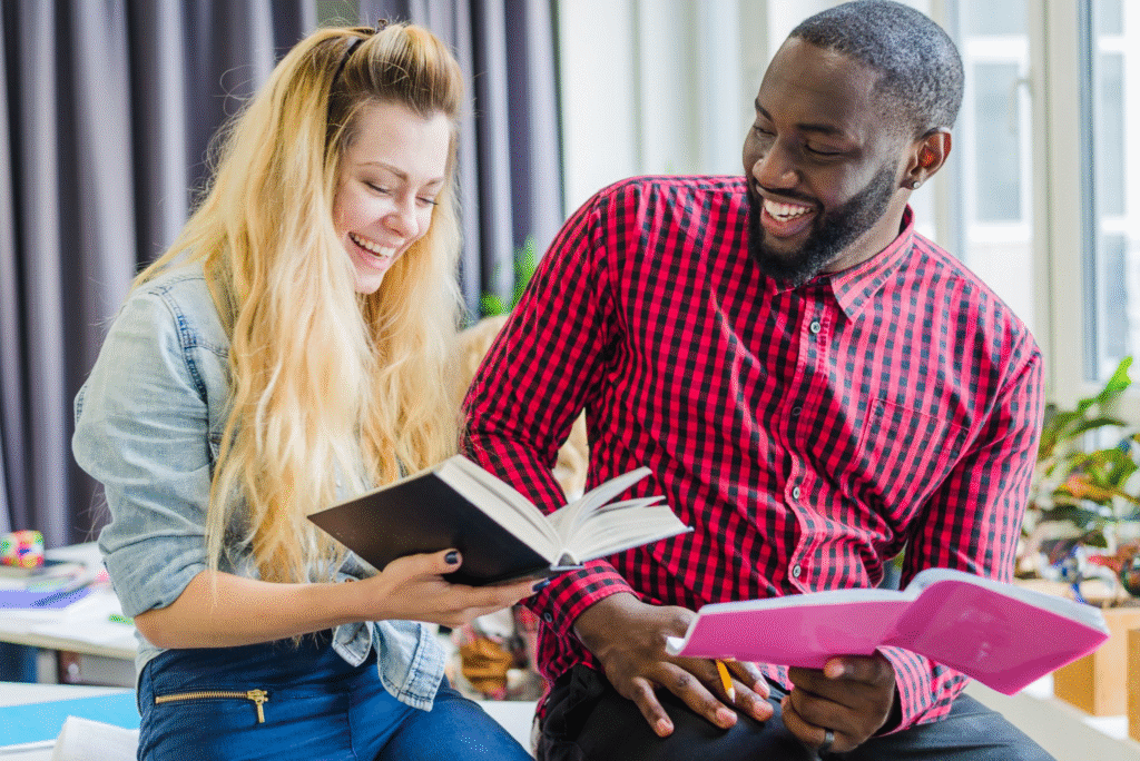 (cheerful-man-woman-with-books_Image by freepiK)